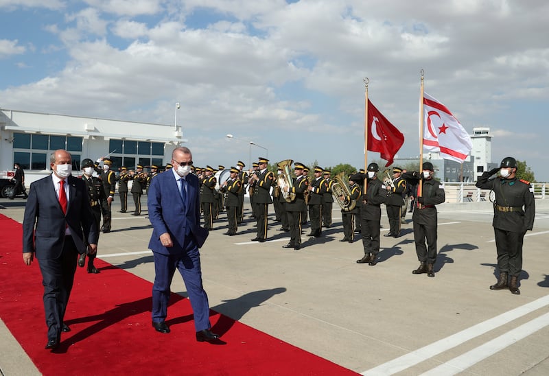 Turkish President Tayyip Erdogan reviews a guard of honour with Turkish Cypriot leader Ersin Tatar before he daparts from the Turkish Republic of Northern Cyprus, a breakway state recognized only by Turkey, in northern Nicosia, Cyprus July 20, 2021.  Murat Cetinmuhurdar/Presidential Press Office/Handout via REUTERS THIS IMAGE HAS BEEN SUPPLIED BY A THIRD PARTY.  NO RESALES.  NO ARCHIVES. 