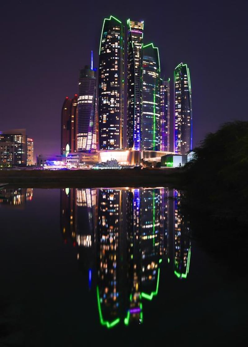 Etihad Towers is lit up in green in support of Abu Dhabi Sustainability Week. Courtesy General Secretariat of the Executive Council