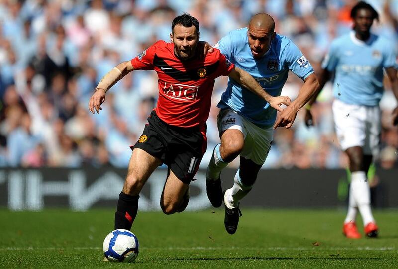 Giggs is challenged by Nigel de Jong of Manchester City in 2010. Getty Images