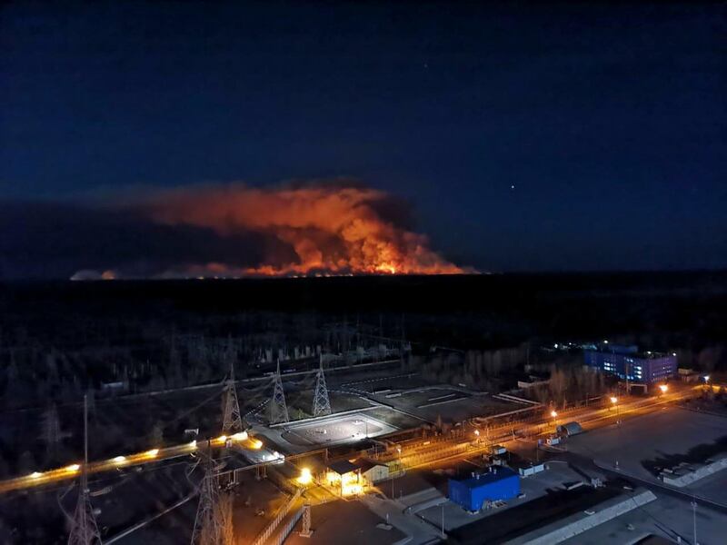 Forest fires light up the night sky in this photo taken from the roof of Ukraine's Chernobyl nuclear power plant. AP