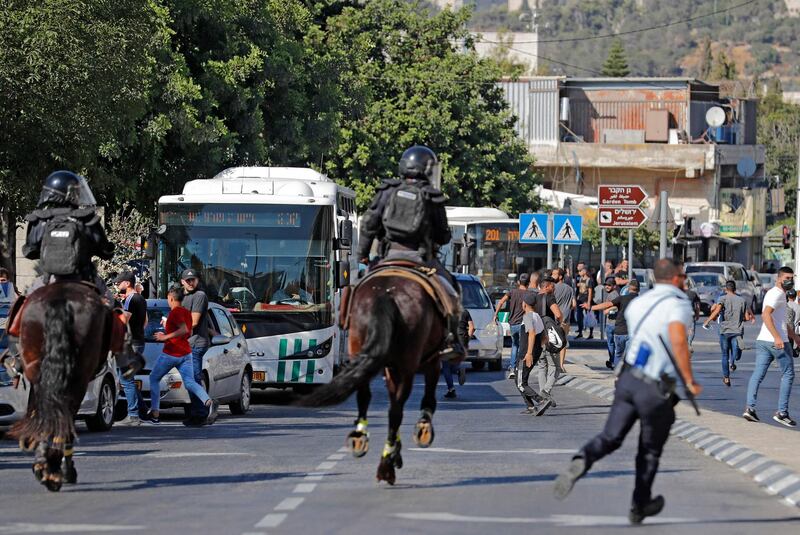 Israeli security forces disperse Palestinians near the Damascus gate in east Jerusalem, ahead of the March of the Flags. AFP