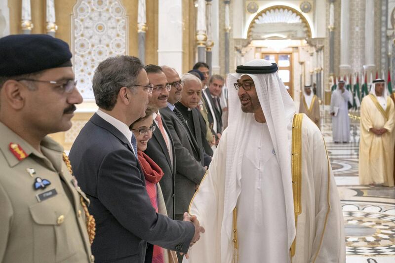 ABU DHABI, UNITED ARAB EMIRATES - November 18, 2018: HH Sheikh Mohamed bin Zayed Al Nahyan, Crown Prince of Abu Dhabi and Deputy Supreme Commander of the UAE Armed Forces (R) greets a delegation member accompanying HE Imran Khan, Prime Minister of Pakistan (not shown), during a reception held at the Presidential Palace. 

( Hamad Al Kaabi / Ministry of Presidential Affairs )?
---