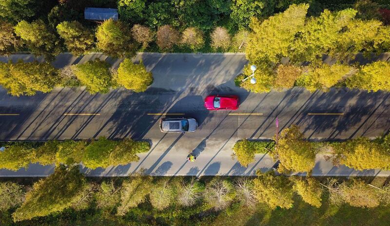 Cars drive along a road in Yangzhou in China's eastern Jiangsu province. AFP