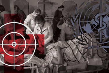 Medical workers move a patient in the basement of a maternity hospital that has been converted into a medical ward and bomb shelter in Mariupol, Ukraine, Tuesday, March 1, 2022.  (AP Photo / Evgeniy Maloletka)