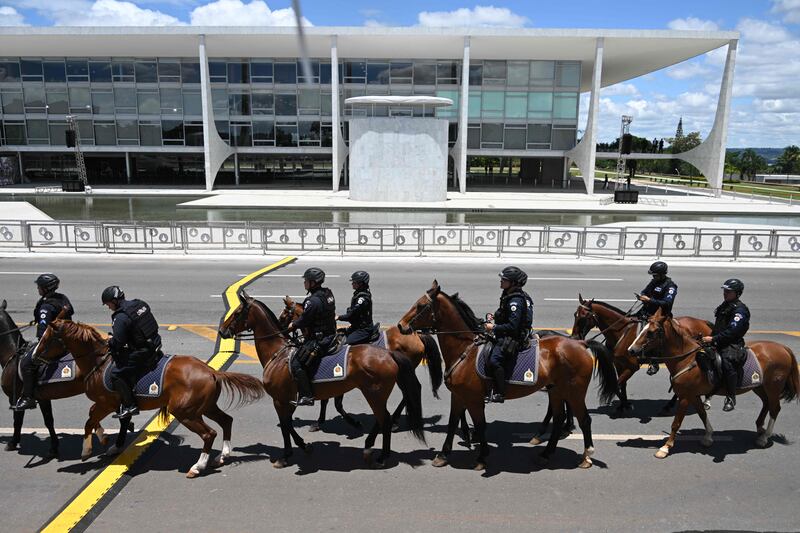 Mounted police patrol in front of the Planalto Palace in Brazil. AFP