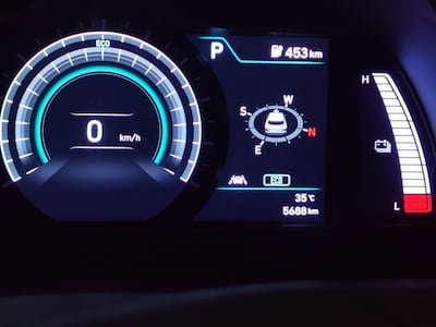 A display showing the full range after charging the car in Dubai