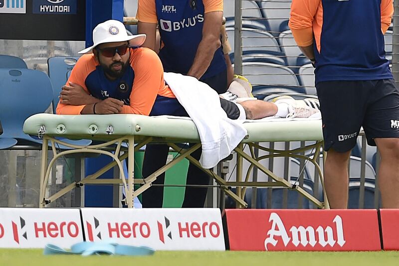 Rohit Sharma receives a massage during a practice session in Pune on Monday, March 22, 2021. AFP