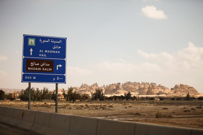 A road sign stands near the ancient heritage site at Al Ula, Saudi Arabia. Saudi Arabia's Crown Prince Mohammed Bin Salman officially launched his vision of the mega tourism project at the ancient site of Al Ula. Bloomberg