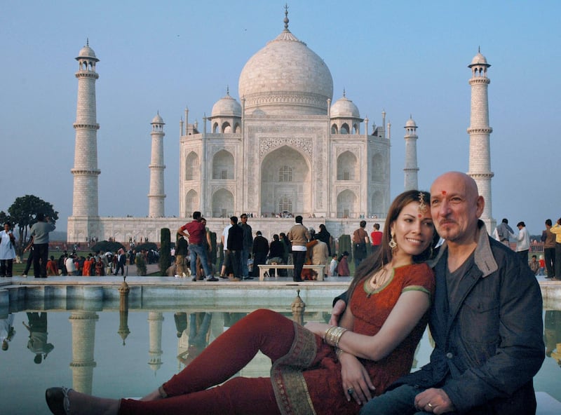 TO GO WITH Entertainment-India-Bollywood-Britain-people,FOCUS by Shail Kumar Singh

(FILES) In this picture taken on December 2, 2009, British actor Ben Kingsley (R) who played the role of Mohandas Gandhi in the film 'Gandhi', poses with his wife Daniela Lavender in front of the historic Taj Mahal monument in Agra. British actor Ben Kingsley this week makes his debut in a Bollywood film, nearly 30 years after his Oscar-winning performance in "Gandhi" that catapulted him to worldwide fame. The 66-year-old plays a brilliant mathematician, Perci Trachtenberg, in the thriller "Teen Patti" (Three Cards) who meets a reclusive fellow academic, Venkat, at a London casino.   AFP PHOTO/STR/FILES (Photo by STR / AFP FILES / AFP)