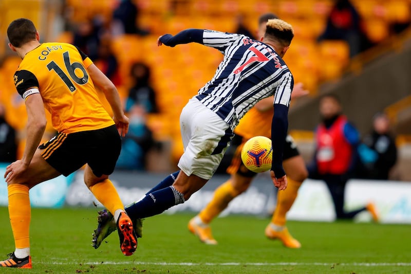Wolves defender Conor Coady fouls Callum Robinson to give West Brom another penalty