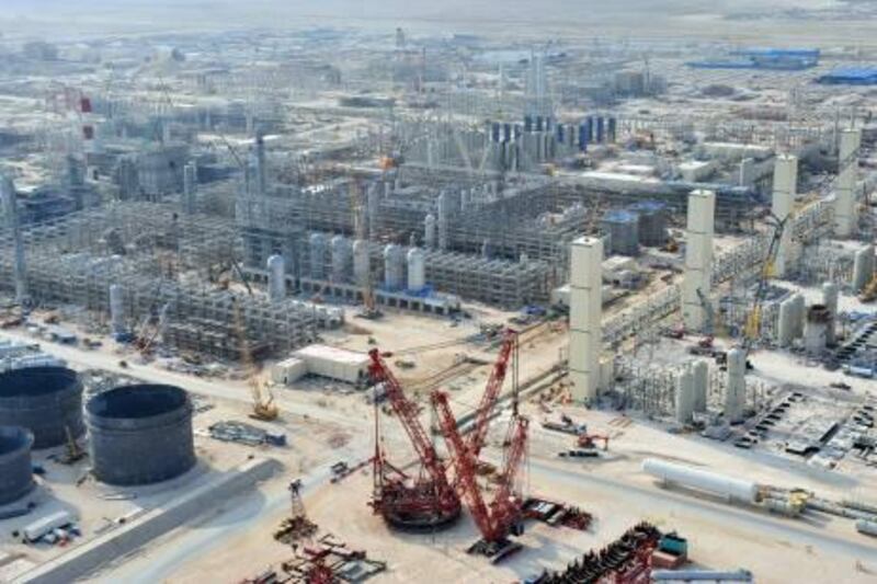 An aerial view of the construction of the Pearl, the world's largest gas-to-liquids plant, in Qatar, is seen in this undated handout photograph provided to the media on Thursday, March 4, 2010. Royal Dutch Shell Plc spent $19 billion, triple the original estimate, to build the Pearl plant. Source: Shell International Ltd. via Bloomberg  EDITOR'S NOTE: NO SALES. EDITORIAL USE ONLY *** Local Caption ***  641850.jpg