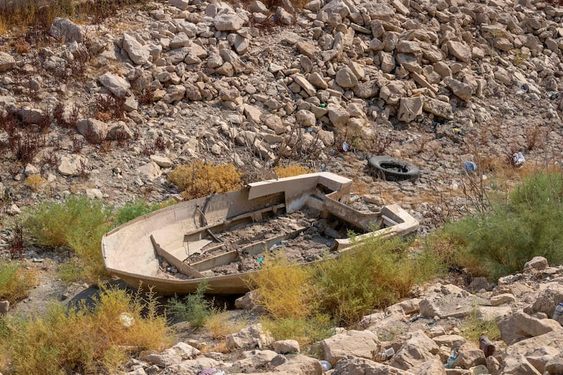 A dilapidated boat in a dried-up canal of Habbaniyah Lake in Iraq's Anbar province. AFP