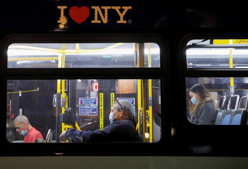 Passengers ride a bus along 1st Avenue in Manhattan, New York, US. Reuters