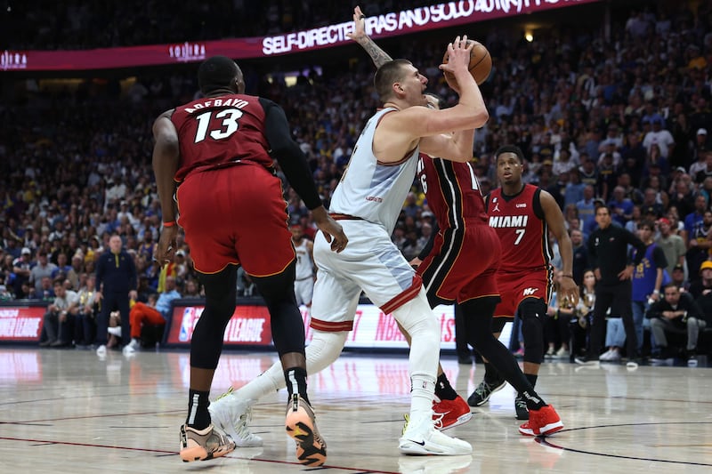 Nikola Jokic drives to the basket against Caleb Martin of the Miami Heat. AFP