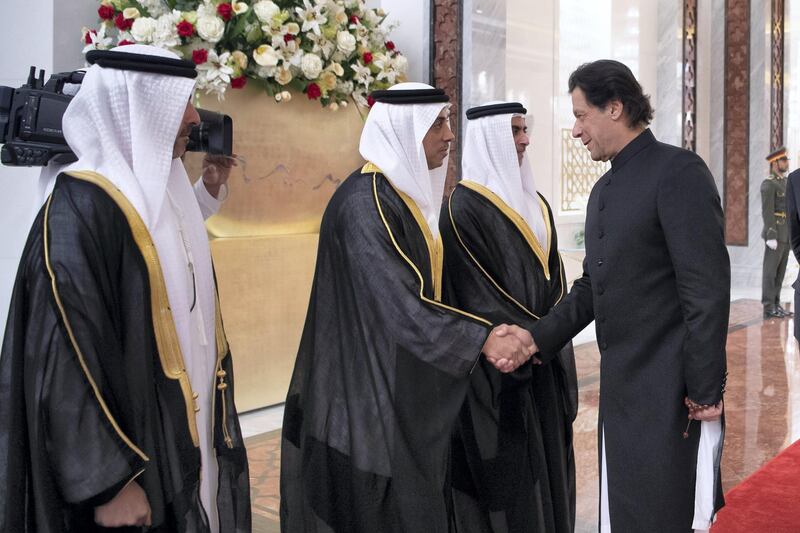 ABU DHABI, UNITED ARAB EMIRATES - September 19, 2018: HH Sheikh Mansour bin Zayed Al Nahyan, UAE Deputy Prime Minister and Minister of Presidential Affairs (2nd L), greets HE Imran Khan Prime Minister of Pakistan (R), during a reception at the Presidential Airport. Seen with HH Sheikh Hamed bin Zayed Al Nahyan, Chairman of the Crown Prince Court of Abu Dhabi and Abu Dhabi Executive Council Member (L) and HH Lt General Sheikh Saif bin Zayed Al Nahyan, UAE Deputy Prime Minister and Minister of Interior (3rd L).  

( Saeed Al Neyadi / Crown Prince Court - Abu Dhabi )
---