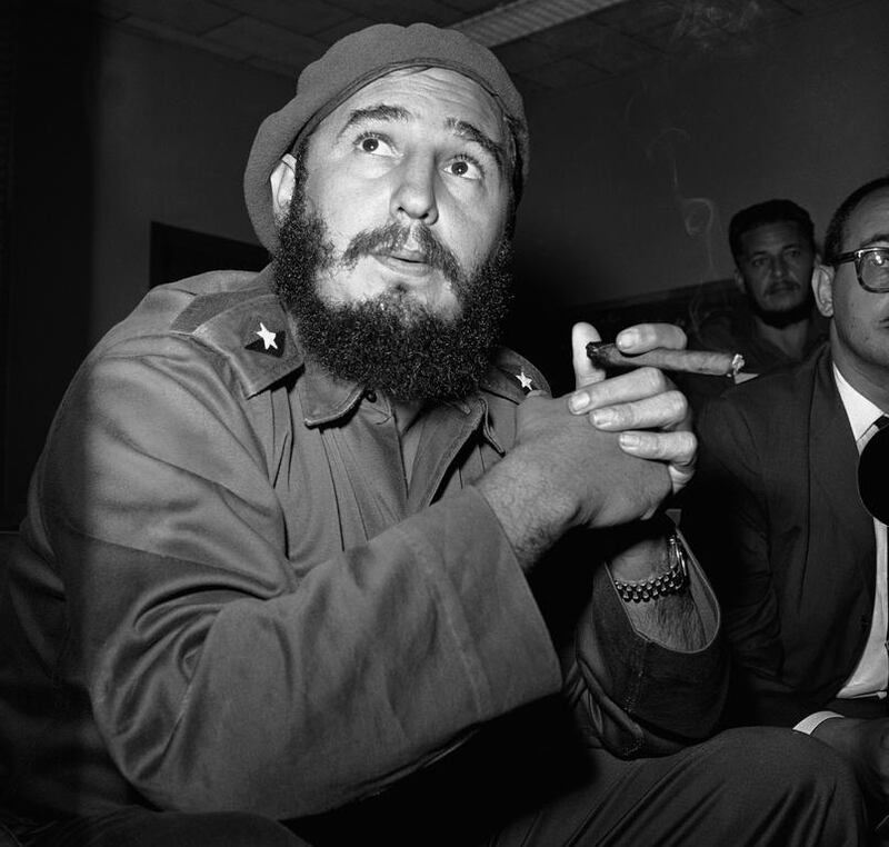 Cuban strongman Fidel Castro enjoys a cigar in 1961. Cuban cigars have been illegal in the US since a trade embargo in 1961. AP Photo

