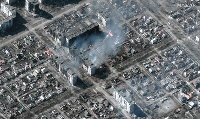 Burning and destroyed high-rise apartment buildings in Mariupol, south-eastern Ukraine. AFP