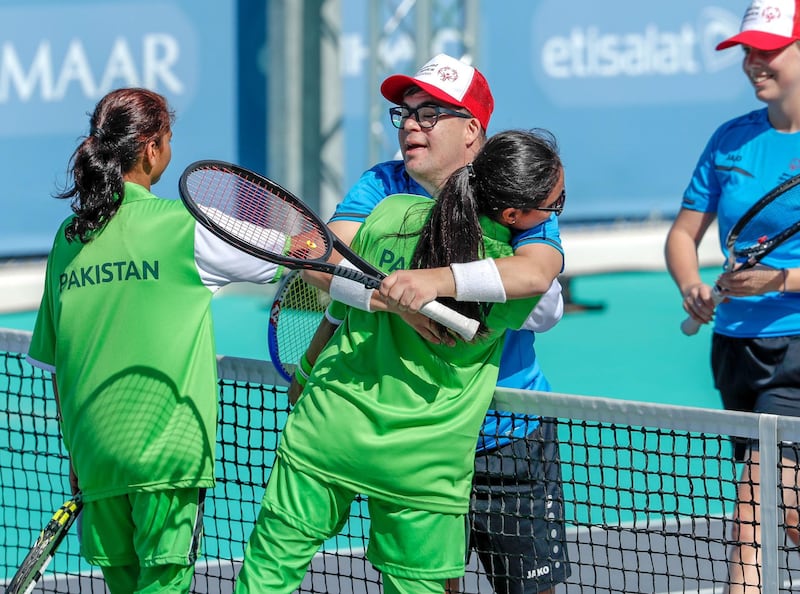 Abu Dhabi, March 19, 2019.  Special Olympics World Games Abu Dhabi 2019.  Tennis at the Zayed Sports City.  Andreas Aprile  (Liechenstein) hugs his Pakistani competitors after winning the match.
Victor Besa/The National