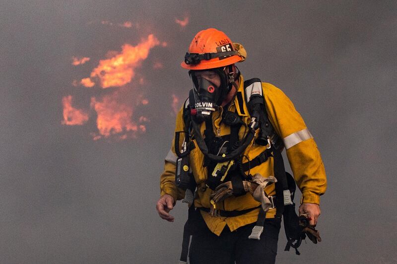 Firefighters work at extinguishing the Tick Fire in a factory near Santa Clarita. EPA