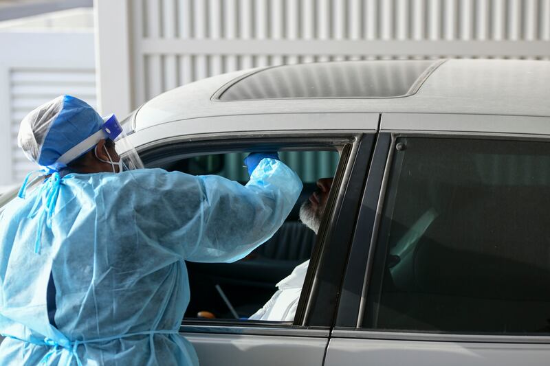 Covid testing carried out at Seha drive through screening centre in Rabdan, Abu Dhabi. Khushnum Bhandari / The National
