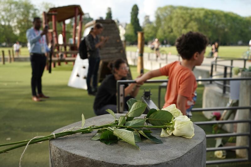 Flowers left at the playground after the knife attack. AP