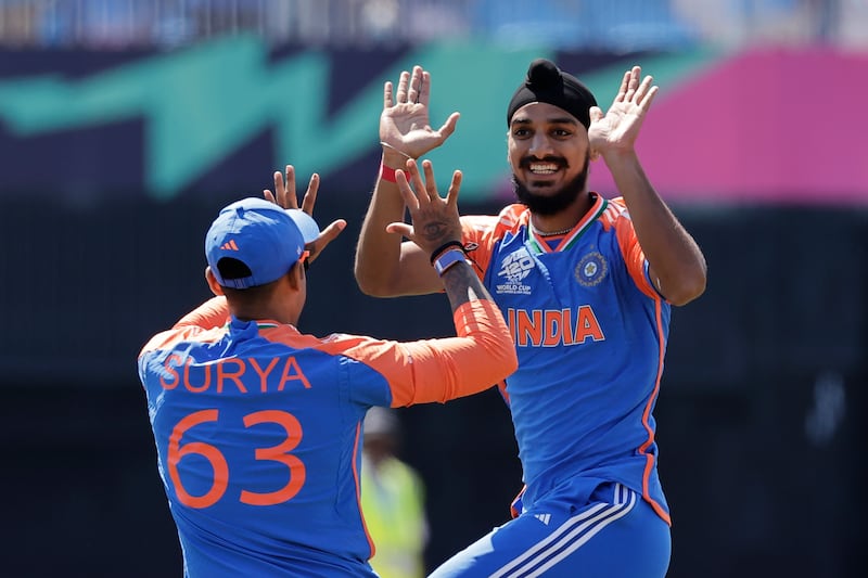 India's Arshdeep Singh, right, celebrates with teammate Suryakumar Yadav after the dismissal of United States' Shayan Jahangir during the ICC Men's T20 World Cup cricket match between United States and India at the Nassau County International Cricket Stadium in Westbury, New York, Wednesday, June 12, 2024.  (AP Photo / Adam Hunger)