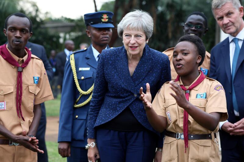 Britain's Prime Minister Theresa May listens to a presentation during her visit to the United Nations complex within Gigiri in Nairobi, Kenya August 30, 2018. REUTERS/Stringer