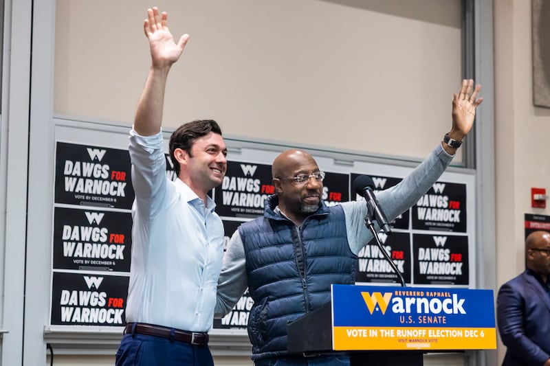 Mr Warnock alongside fellow senator from Georgia Jon Ossoff. EPA