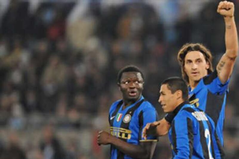 Zlatan Ibrahimovic, right, salutes the Inter fans after scoring.