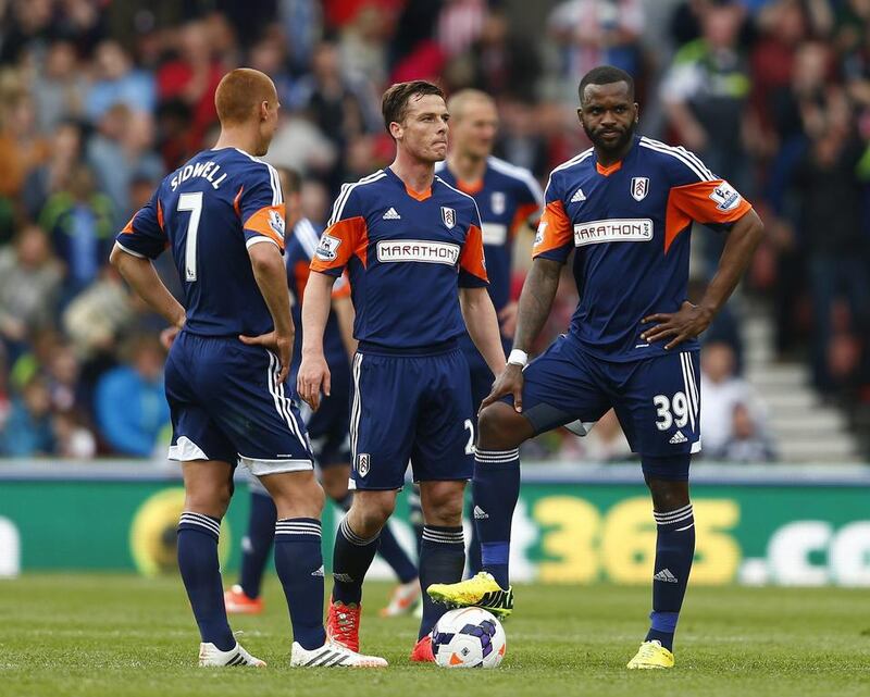 From left, Fulham players Steve Sidwell, Scott Parker and Darren Bent react during their Premier League match against Stoke City at the Britannia stadium on May 3, 2014. Eddie Keogh / Reuters