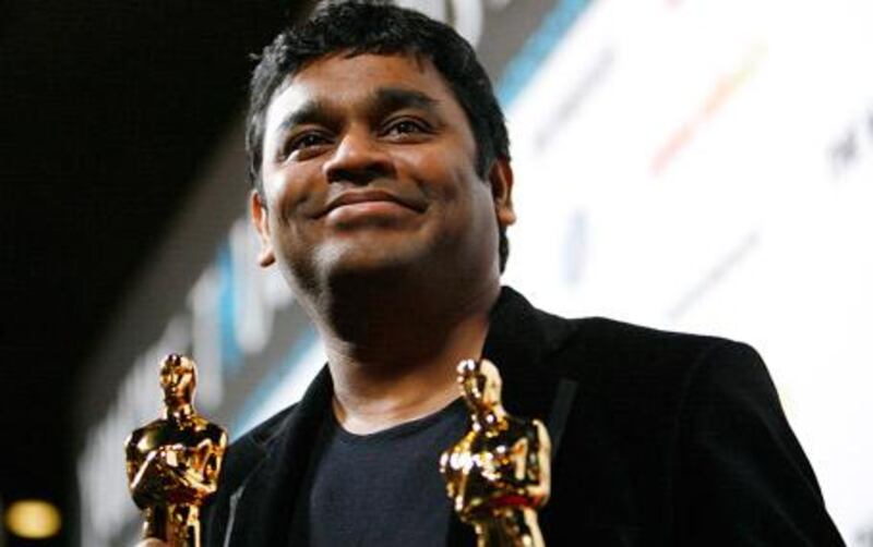 Jai ho! Rahman holds his Slumdog Millionare Oscars (Best Score and Best Original Song) at a post-award party in Los Angeles this February.