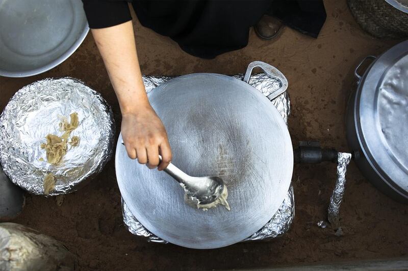 Sameera Ali Mohammed prepares traditional bread. Lee Hoagland / The National