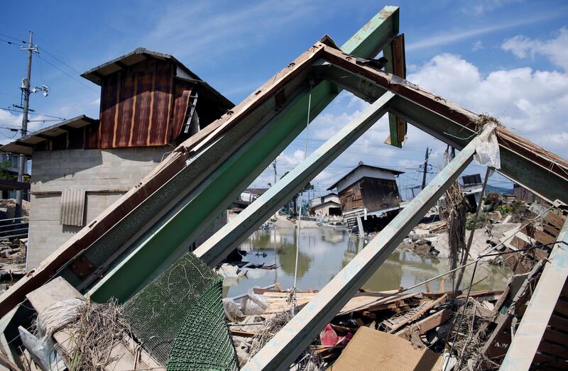 Submerged and destroyed houses in a flooded area in Kurashiki, Okayama. Reuters