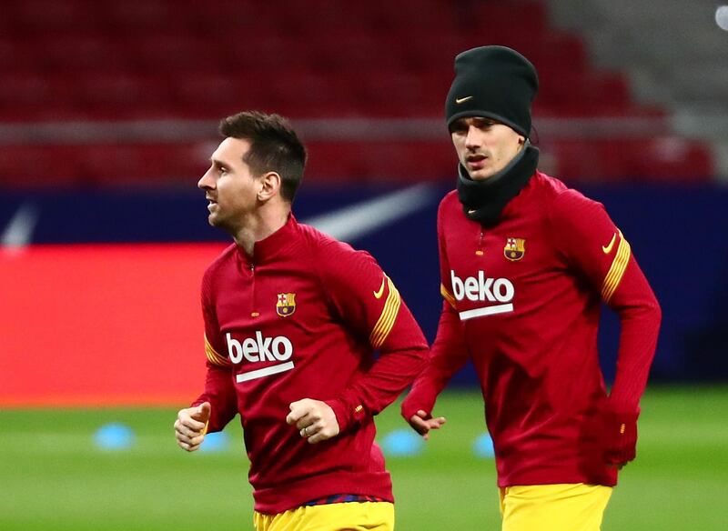 Antoine Griezmann and Lionel Messi warm up before the match between Atletico Madrid and Barcelona at the Wanda Metropolitano. Reuters