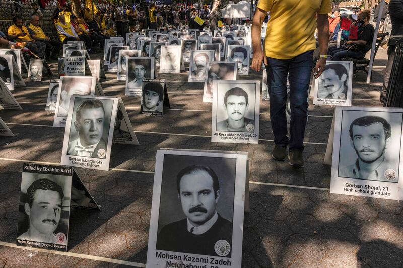 People protest against Mr Raisi at a rally in New York, as he attends the UN General Assembly.  AFP
