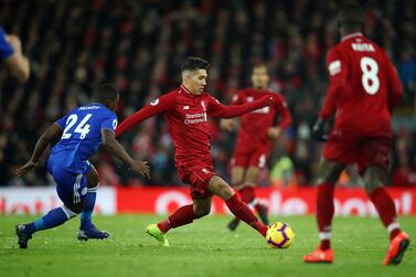 Liverpool's Roberto Firmino evades a challenge the match against Leicester City at Anfield. GETTY IMAGES