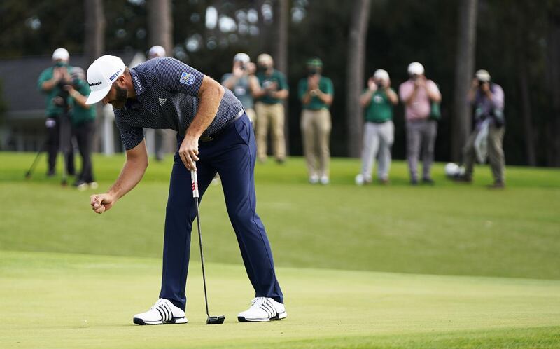 Dustin Johnson of the US reacts after sinking his putt to win on the eighteenth hole. EPA