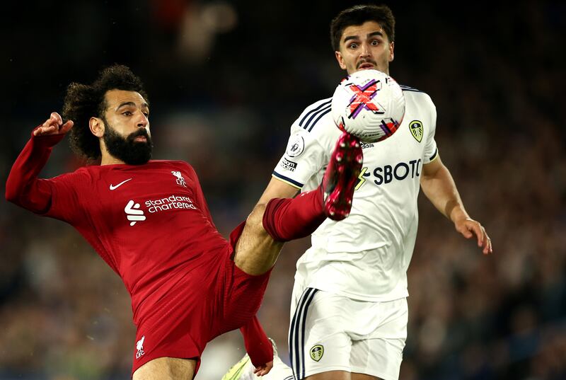 Pascal Struijk, right, of Leeds in action against Mohamed Salah of Liverpool. EPA