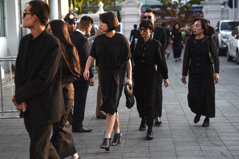 Mourners from Thailand's elite arrive at the temple. AFP