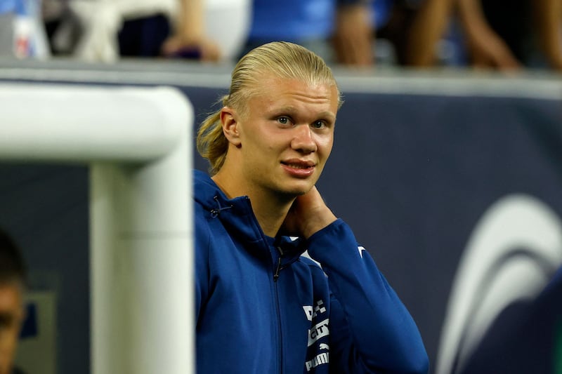 Manchester City's Erling Haaland looks on from the bench. AFP
