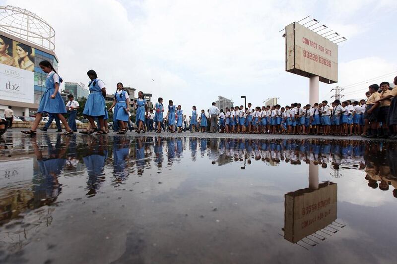 
MUMBAI , INDIA – June 22 : School kids are going to take part in the clean hands to save life campaign held at the Centre One Mall in Vashi in Navi Mumbai. Water logged because of rain in Vashi area in Mumbai. ( Pawan Singh / The National ) For News. Story by Surya
