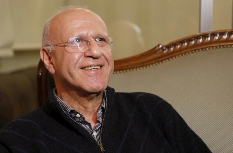Former Lebanese information minister Michel Samaha smiles at his house in Beirut. Mohamed Azakir / Reuters