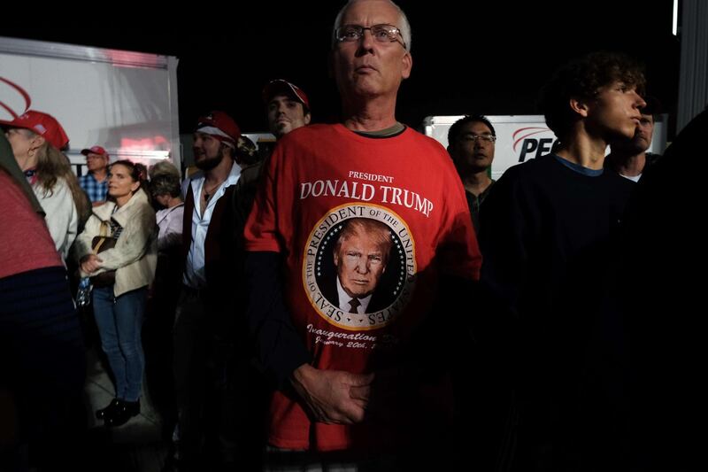 People listen as President Donald Trump speaks at a rally at Harrisburg International Airport after announcing Amy Coney Barrett as his choice to be the new Supreme Court justice. AFP