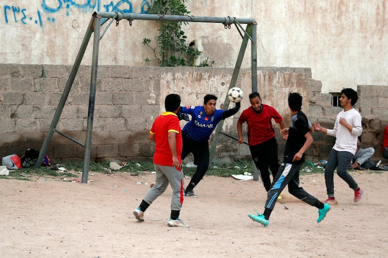 Yemeni youth take part in a football match in Sana'a, Yemen. EPA