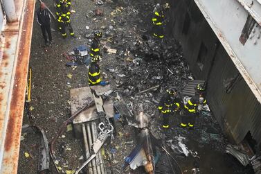 epa07639786 A handout photo made available by the Fire Department of the City of New York (FDNY) shows New York City firefighters working at the scene of a helicopter crash on the roof of the Equitable Building in midtown Manhattan, New York, USA, 10 June 2019. According to media reports at least one person was killed in the crash. EPA/FDNY / HANDOUT HANDOUT EDITORIAL USE ONLY/NO SALES