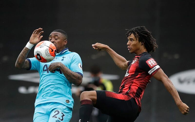 Tottenham Hotspur's Dutch midfielder Steven Bergwijn (L) vies for the ball with Bournemouth's Dutch defender Nathan Ake  during the English Premier League football match between Bournemouth and Tottenham Hotspur at the Vitality Stadium in Bournemouth, southern England, on July 9, 2020. (Photo by Matt Dunham / POOL / AFP) / RESTRICTED TO EDITORIAL USE. No use with unauthorized audio, video, data, fixture lists, club/league logos or 'live' services. Online in-match use limited to 120 images. An additional 40 images may be used in extra time. No video emulation. Social media in-match use limited to 120 images. An additional 40 images may be used in extra time. No use in betting publications, games or single club/league/player publications. / 