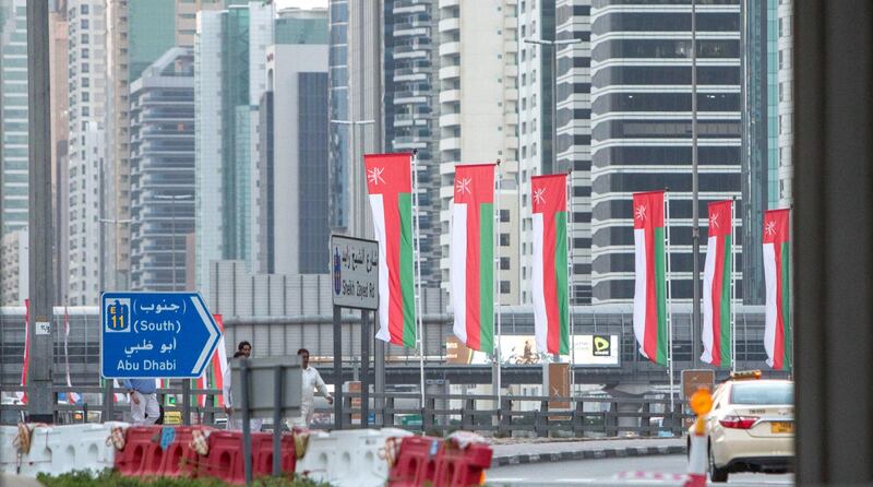 Dubai, United Arab Emirates- Omani flags on display at Sheikh Zayed Road roundabout.  Leslie Pableo for The National
