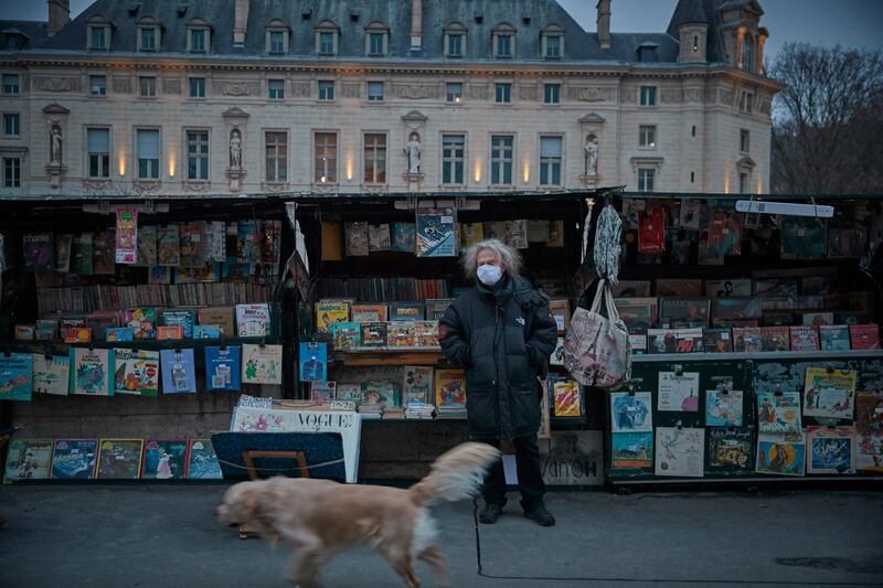 Fancis, who celebrates working as a Bouquiniste for forty years this year, stands in front of his book stall in Paris, France. The open-air booksellers have been hit hard by the coronavirus. Getty Images