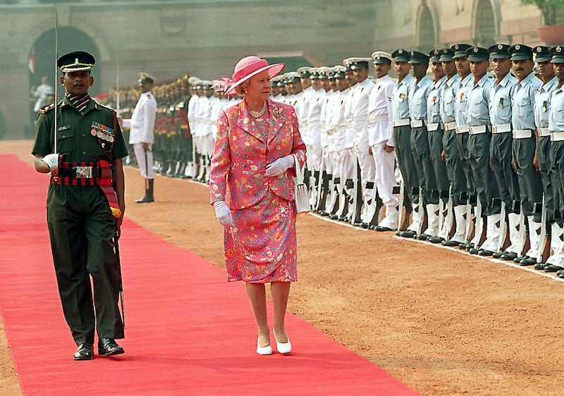 Queen Elizabeth inspects a guard of honour at the presidential palace in New Delhi in October 1997, where she was given a ceremonial welcome. The visit was the queen's third to India. AFP