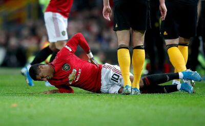 File photo dated 15-01-2020 of Manchester United's Marcus Rashford lies in pain after picking up an injury. PA Photo. Issue date: Thursday January 16, 2020. Marcus Rashford is a major injury doubt for Manchester United's visit to Liverpool this weekend after Ole Gunnar Solskjaer admitted bringing the striker off the bench "backfired" in the FA Cup win over Wolves. See PA story  SOCCER Man Utd. Photo credit should read Martin Rickett/PA Wire.